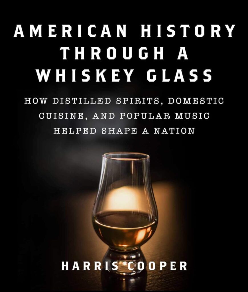 A book cover with a glass of whiskey